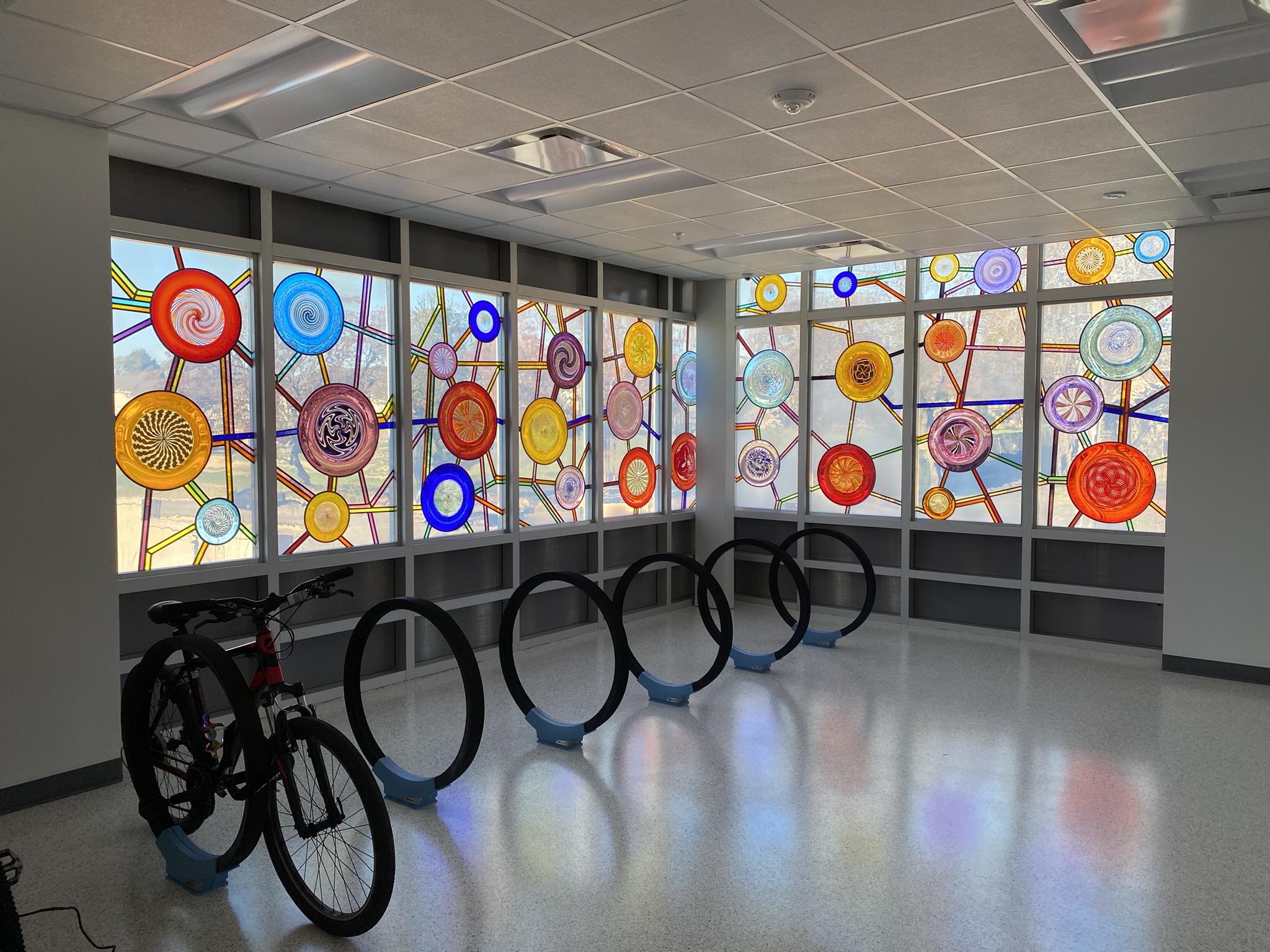 Picture of "Making Connections,” a public artwork by Tyler Kimball of Monarch Glass Studios installed at Lawrence's MultiModal Transit Facility.